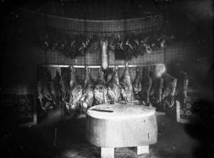 Butchers shop interior, with carcasses