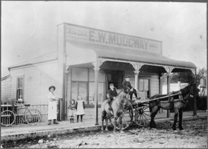 People, horses and a cart, in front of the bakery of E W Mudgeway, Main Street, Upper Hutt