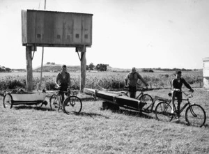Boys towing their boats home to Levin with bicycles