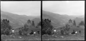 Group, including Edgar Richard and Owen William Williams, sitting in field, Leith, Waikouaiti, Dunedin, Otago Region