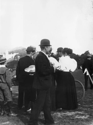 Unidentified group at the Basin Reserve, Wellington. Wellington College on left in background.