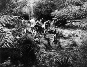 Members of the New Zealand Home Guard, Somes Platoon of Bush Guides, on reconnaissance of upper Orongorongo river