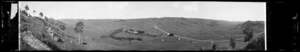 Hawke's Bay farmland, home and buildings. Road. Tree trunks