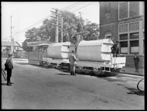 Steam tram towing boiler tanks, near a bridge, Christchurch