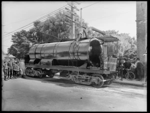 Christchurch Tramways vehicle lubricating bends in tramlines, surrounded by boys and men, Christchurch