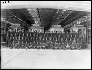 A formal group photograph of Christchurch Tramways staff, tram depot, Christchurch