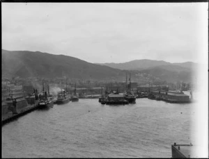 Wellington waterfront, including steamships docked at wharves, and city buildings