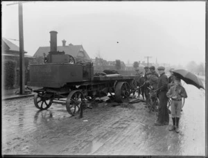 A St Pancras Iron Company steam lorry, stuck in mud, surrounded by male spectators, Christchurch