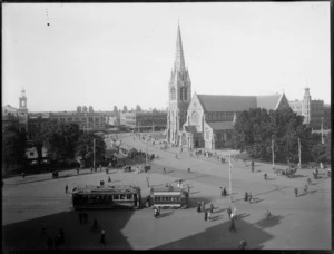 Cathedral Square, Christchurch, showing Christchurch Cathedral, trams and pedestrians, and The Christchurch Press building at right