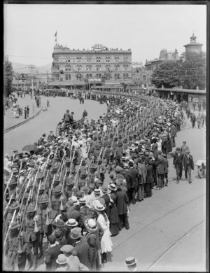 World War I troops marching through Cathedral Square, Christchurch, showing the United Service Hotel in background
