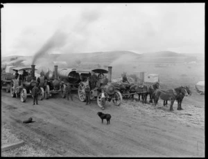 A group of steam traction engines, with horse drawn carts alongside, Coalgate, Selwyn District, Canterbury region