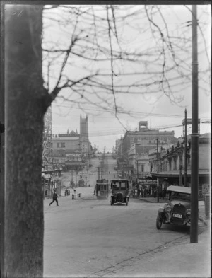 View of Wellesley Street, Auckland, including pedestrians, motorcars and a tram