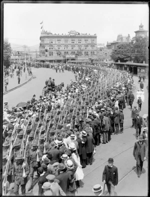 World War I troops parade through Cathedral Square, Christchurch, showing United Service Hotel in background