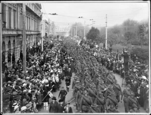 Crowd farewelling World War I troops in Colombo Street, Christchurch, with photographer on step-ladder by Victoria Square