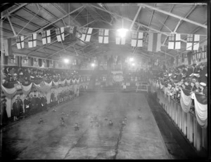 Royal Life Saving Society's swimming competitions, probably in Christchurch, showing crowd watching swimmers in an indoor pool