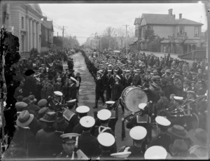Peace celebrations in Christchurch after World War I featuring a military parade including a band and sailors