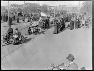 A procession of motor cars and motorcycle sidecars through the streets of Chrisrchurch