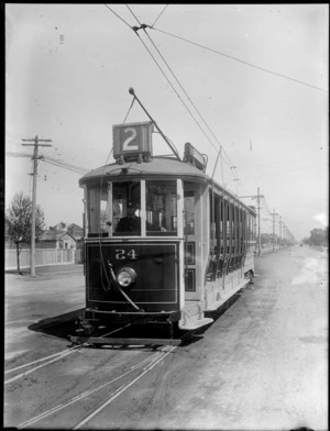 A driver on board a open saloon tram, Christchurch