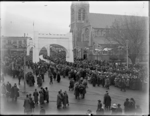 Prince of Wales royal tour, Christchurch, crowds gather at Cathedral Square by the Bridge of Remembrance structures