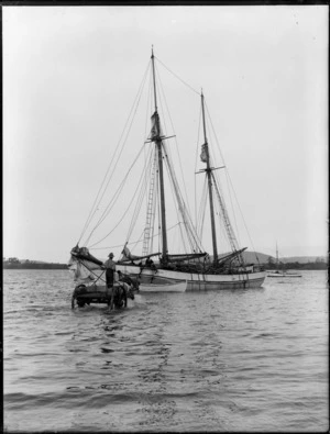 Sailing ketch, Kaiaia, preparing to unload, with man on cart with horse
