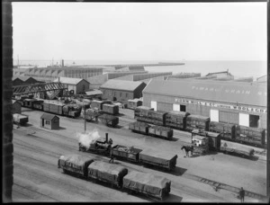 Timaru railway yards, showing carriages and business of John Mill & Company Limited