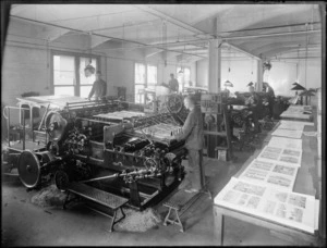The Christchurch Press printing room, with men working on the photogravure printing machine in the foreground