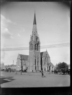 Christchurch Cathedral, with horse-drawn carriages and people in Cathedral Square, Christchurch