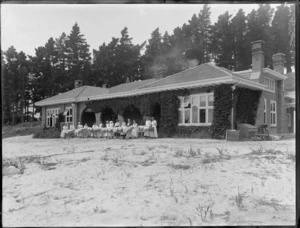 Karitane hospital, Christchurch, showing nurses standing outside with bassinets