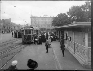 People disembarking and boarding a Fendalton tram at a tram stop in Cathedral Square, Christchurch