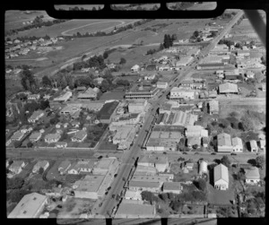 Morrinsville, showing town centre including a large hotel, houses, tea rooms, and business premises of Gummer's clothing, The Hamilton Hardware Company Ltd, and Florida Milk Bar