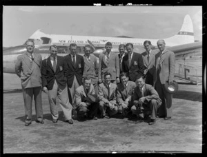 Wellington Plunket Shield representative cricket team of 1955, in front of New Zealand National Airways Corporation aeroplane Matuku ZK-AYV