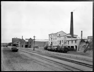 Bedfords Flour Mill, Timaru, with freight carriages and the railyard in the foreground