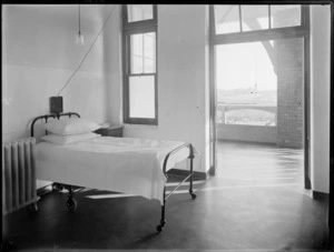 Interior at King George V Coronation Memorial Hospital, Christchurch, with bed and verandah