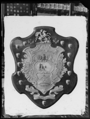 Stevenson Stewart & Co Challenge Shield for rifle shooting, shows smaller sheilds around the edge and a picture of three men in the middle