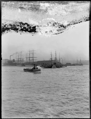 Auckland wharves, showing ships, paddle wheel steamer and tug boat