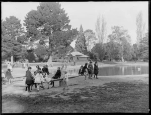 Botanical Gardens, Christchurch, including girls playing on see-saws near pond