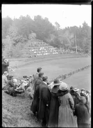 Crowd gathered at the edges of a park, [during royal tour of the Prince of Wales?], New Plymouth