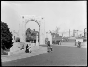 People walking across the Bridge of Remembrance, Christchurch, from Cambridge Terrace into Cashel Street