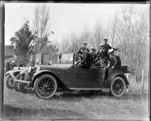 Navy band sit in a car at Little River, Wairewa County, Canterbury