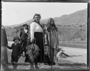 Little River, Wairewa County, Canterbury, showing Maori women and child, one woman holding a taiaha