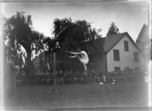 An athlete competing in the high jump competition, location unidentified
