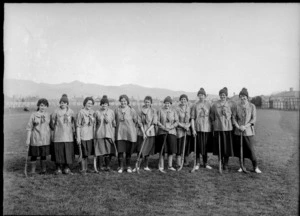 Women's hockey team in uniform and with sticks, possibly Christchurch region