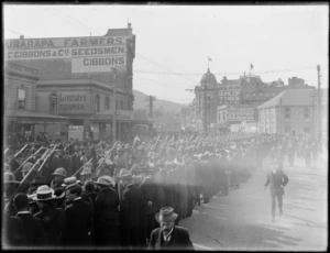 Crowds gather to watch World War I soldiers marching up Lambton Quay, Wellington