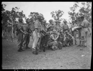 Soldiers at a team talk before manoeuvres in the Pacific during World War 2