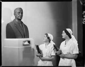 Bust of Sir Thomas Hunter, founder and first director of the School Dental Service, at the Dominion Training School for dental nurses, Willis Street, Wellington, with nurses alongside - Photograph taken by Edward Percival Christensen