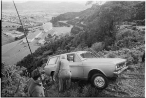 Car being towed up Wainuiomata Hill after an accident