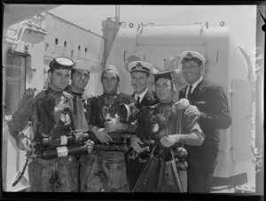 Italian sailors on board the cruiser Raimondo Montecuccoli, including scuba divers with their equipment