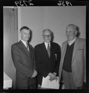 Managers of the 1956 New Zealand Olympic Team Mr L Woods, Mr Squire, and Mr Woodfield