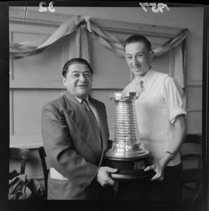 New Zealand chess tournament 1957 joint winners Arcadios Feneridis and James Rodney Phillips holding the trophy