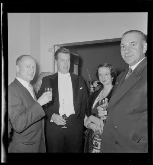 Unidentified guests at cocktail party held for double-amputee and World War II veteran Douglas Robert Steuart Bader and his wife Thelma